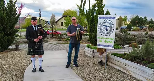 Prosser Scottish Fest & Highland Games - one man playing bagpipes and another with a tambourine. 