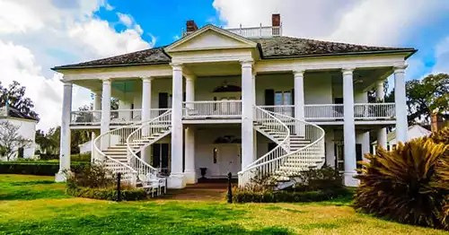 Double staircase on the front of Evergreen Plantation house.