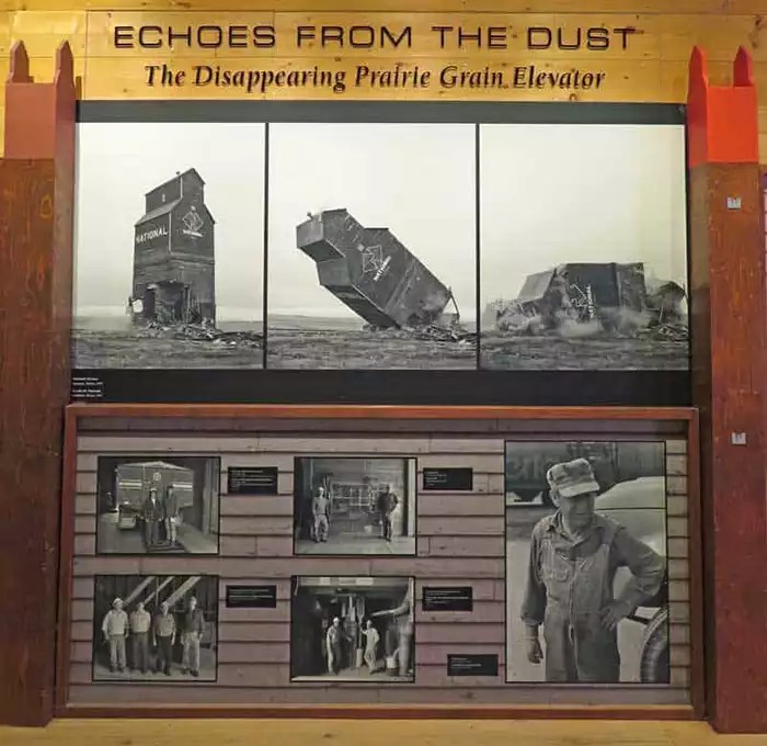 Historic photos on display at the Inglis Grain Elevators National Historic Site show an elevator being demolished .