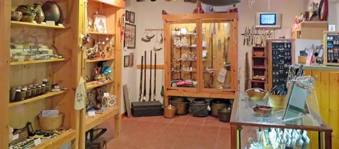 A number of cabinets with dislays of objects directly related to the fur trade era. 