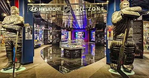 Two hockey player statues at entrance to Hockey Hall of Fame and Museum. 