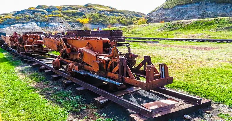 Vintage coal mining equipment on a train track