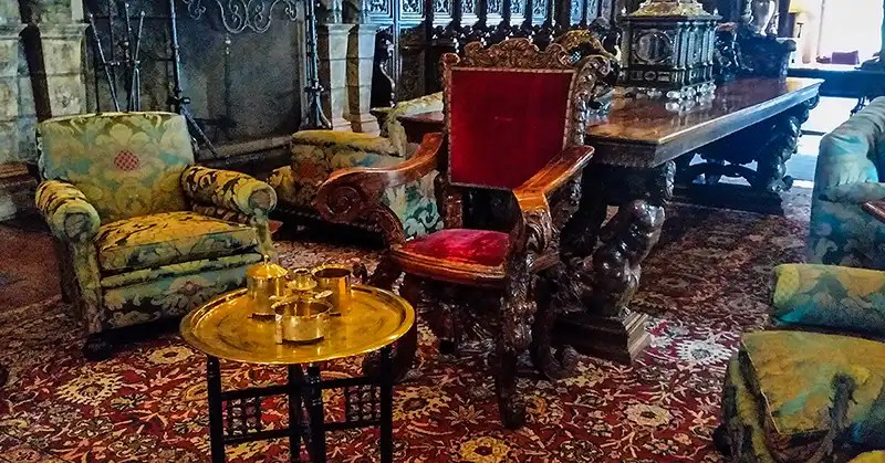 Vintage chairs and a gold tea serving set. 