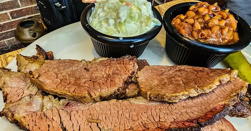 Brisket with coleslaw and beans. 