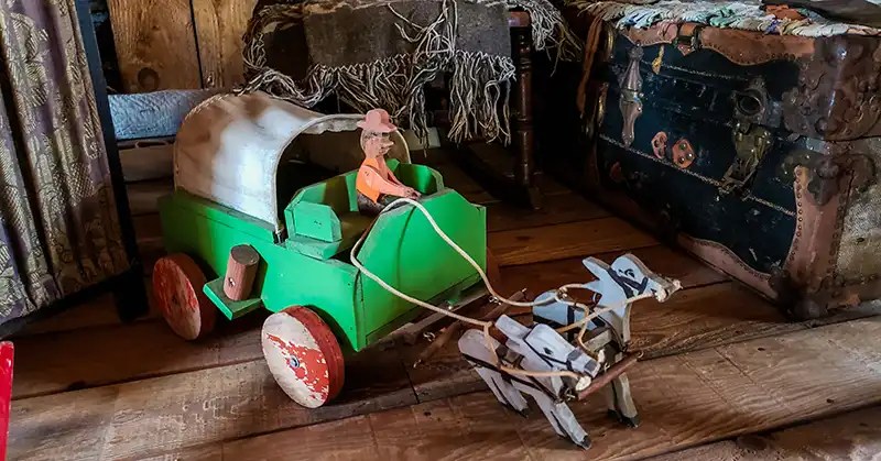 Homemade toy beside a trunk