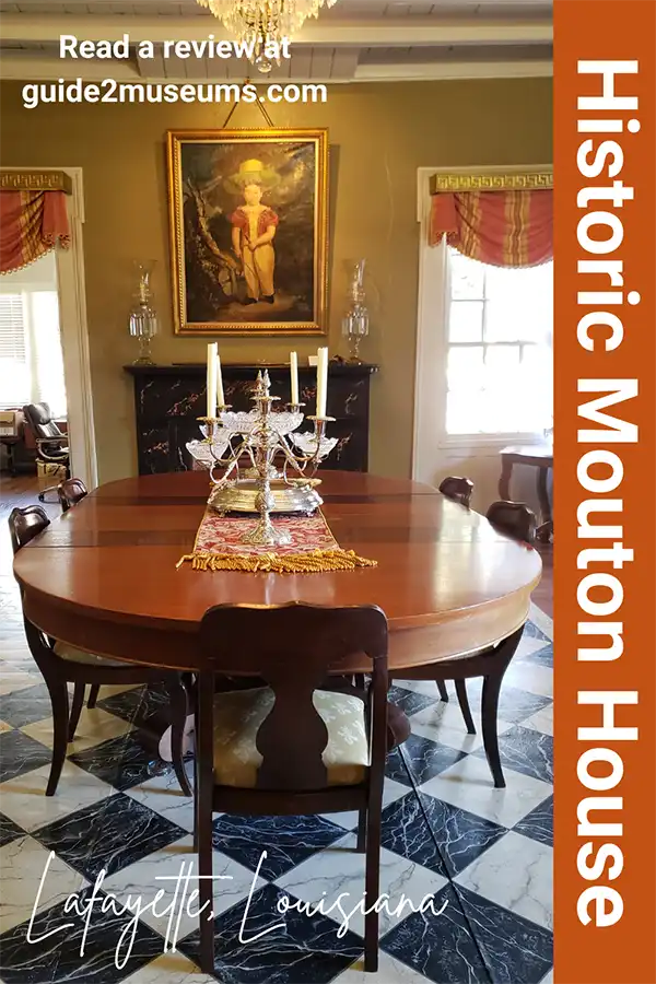 Dining room table and art in the historic Mouton House Lafayette Museum in Lafayette, Louisiana. | Lafayette attractions | Louisiana | museums | historic house |