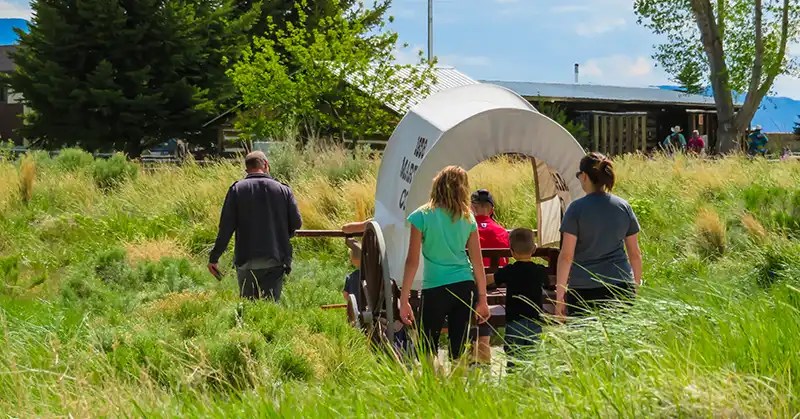 Modern family using a handcart.