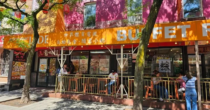 Tree with Chinese paper lanterns in front of a Buffet restaurant in Montreal Chinatown. 
