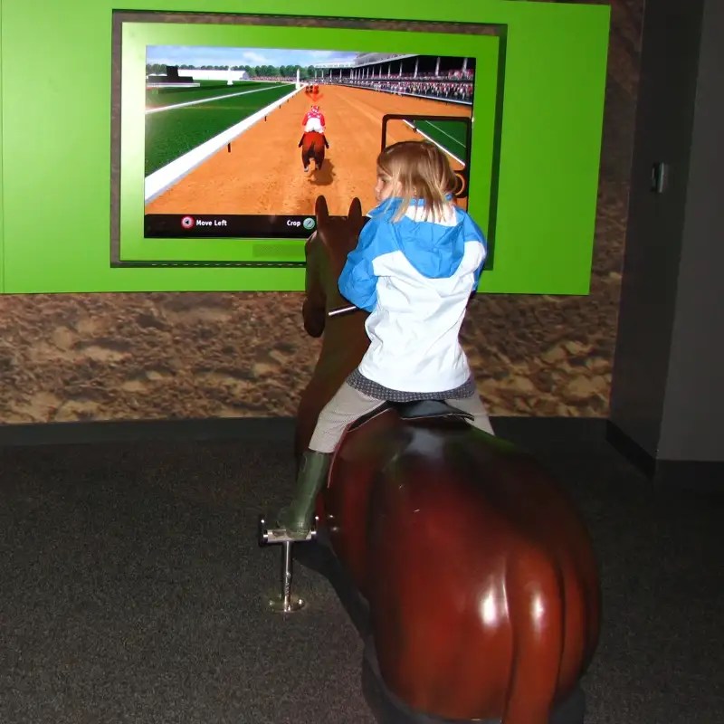 Child in the Rider's Up simulation.