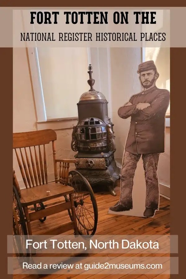 Rocking chair, wood-burning stove, and stand-up figure of a soldier at Fort Totten, North Dakota