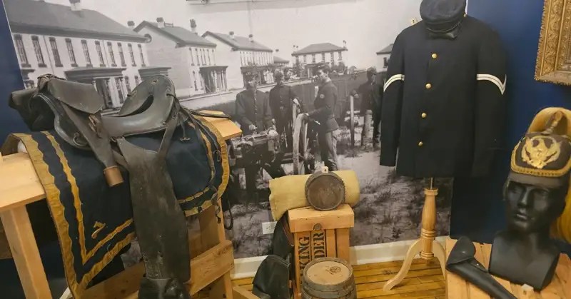 Black military saddle and a frontier soldier's uniform