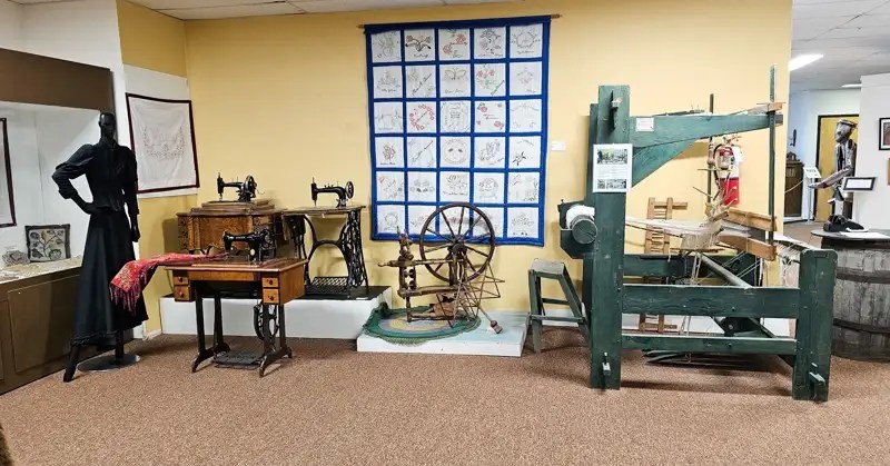 Machines including several sewing machines spinning wheel, and loom. 