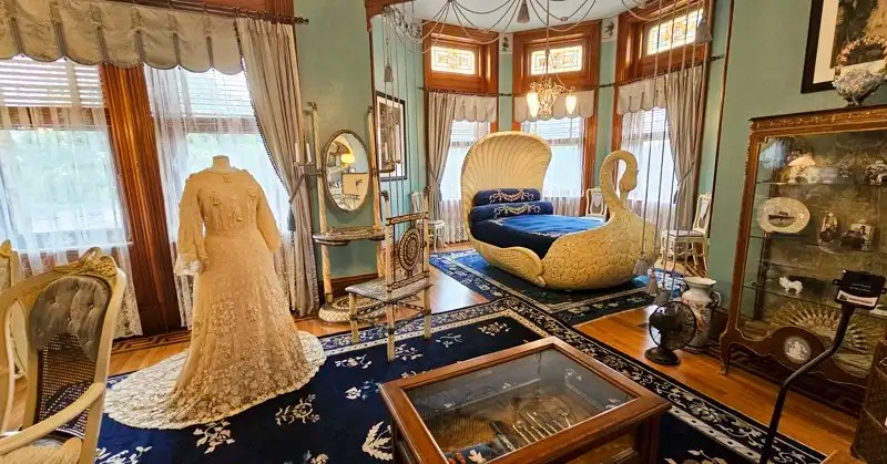 Sallie Dooley’s room, with its magnificent swan bed, Louis Vuitton trunk and Tiffany dressing table crafted with sterling silver and narwhal tusks. 